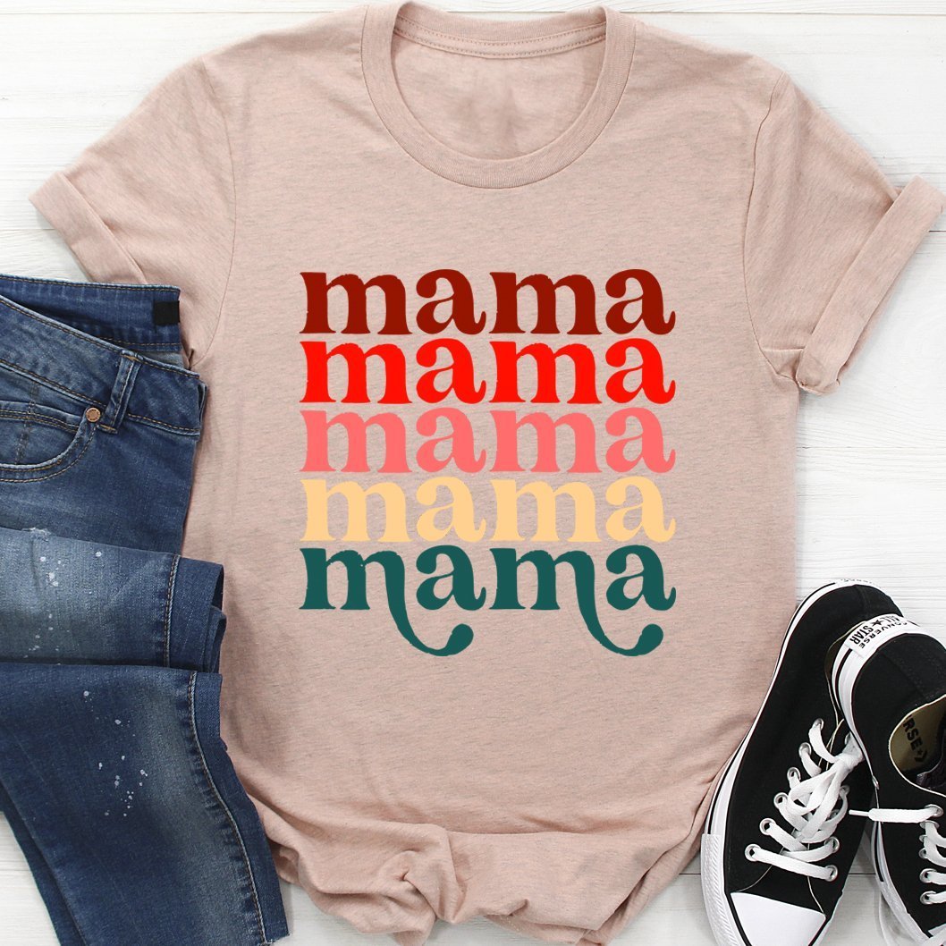 Mama Vintage Colors T-Shirt on wooden background paired with jeans and sneakers, showcasing a chic and trendy style with multicolored 'mama' print for fashionable mothers.