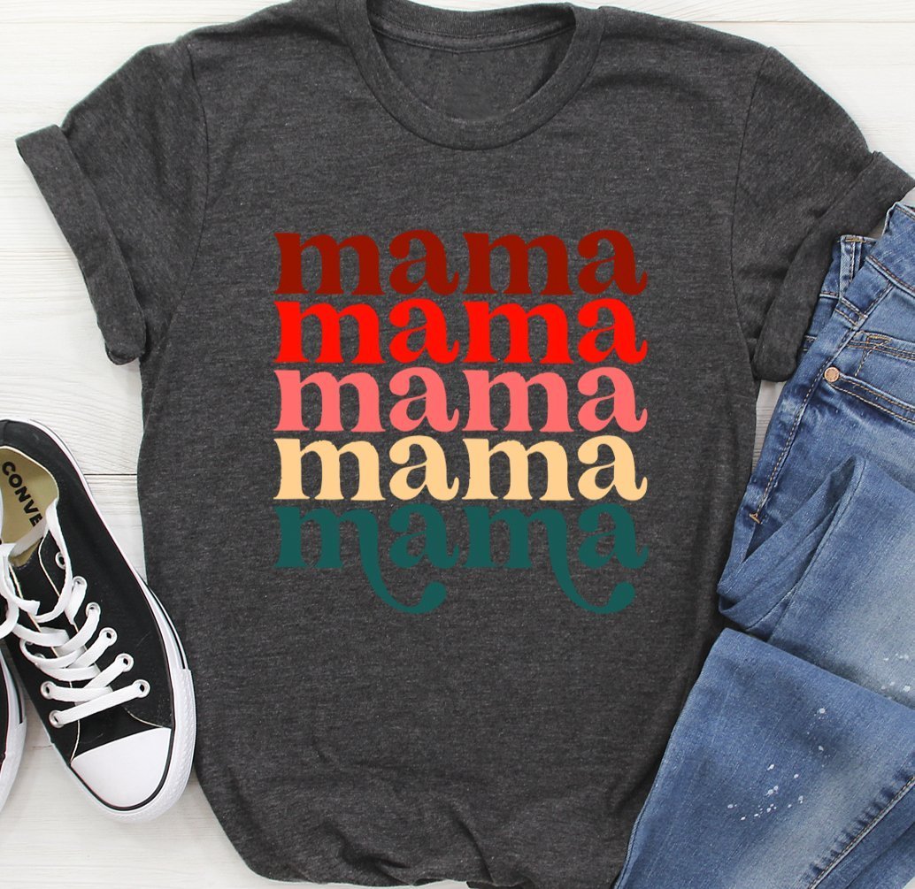 Charcoal gray Mama Vintage Colors T-Shirt laid flat with multicolor 'mama' print, paired with casual jeans and white sneakers.