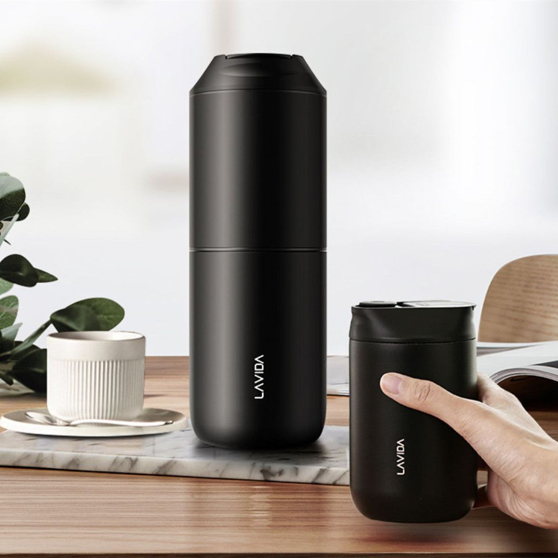 Portable electric coffee grinder with USB charging cable and transparent lid.