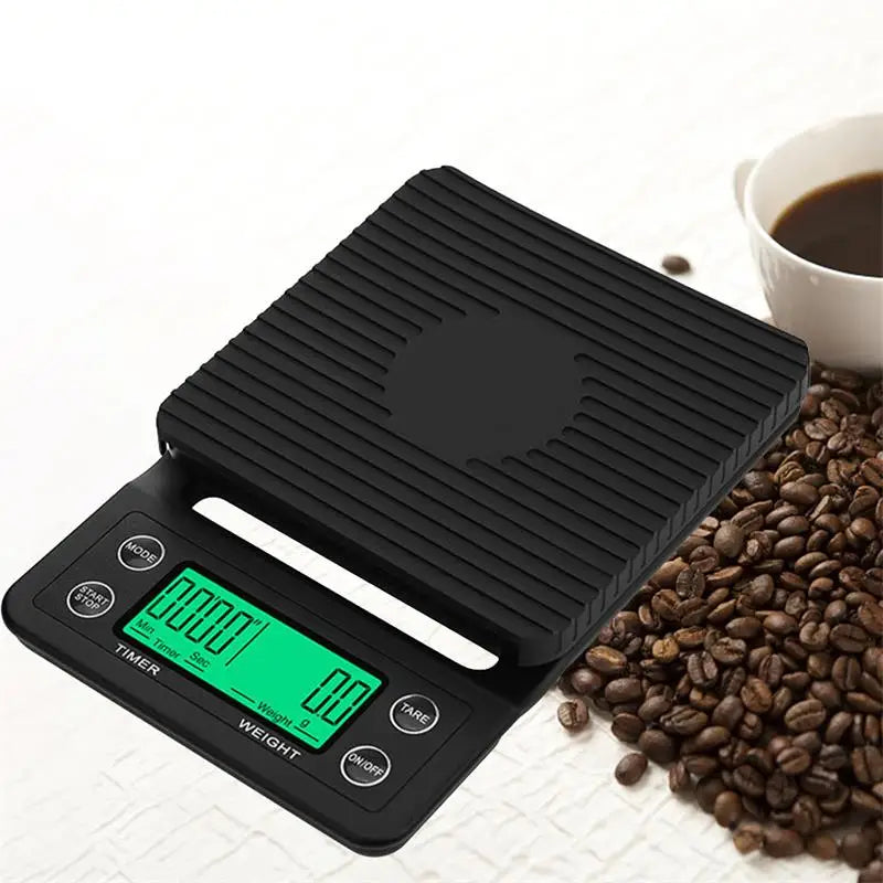 Digital kitchen scale with coffee beans and a cup of coffee on a white background