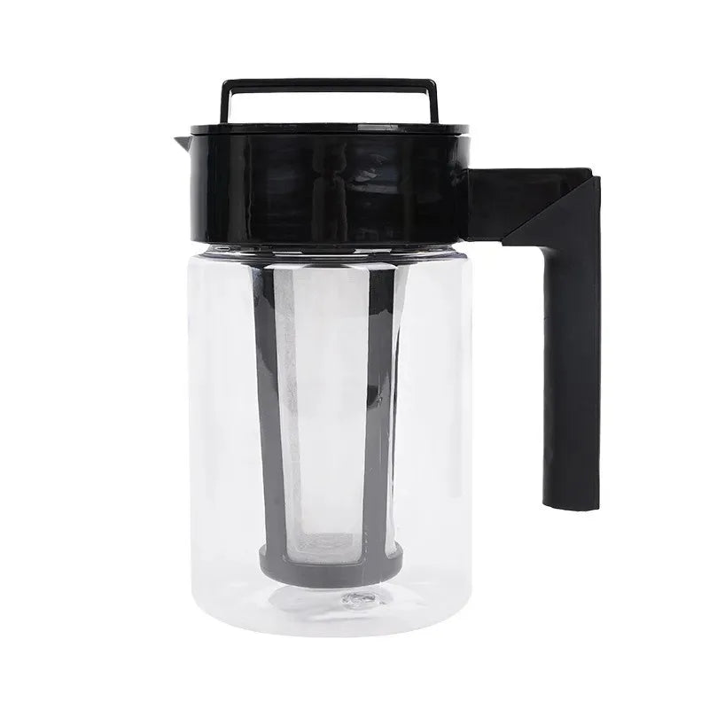 Clear glass pitcher with black lid and handle on a white background