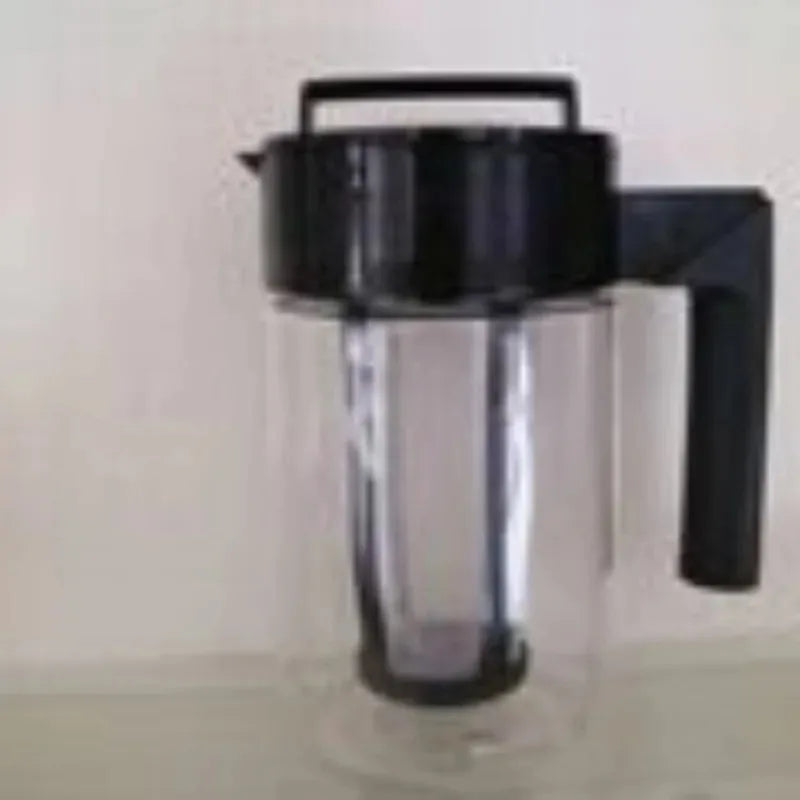 Clear pitcher with black lid and handle on a light background
