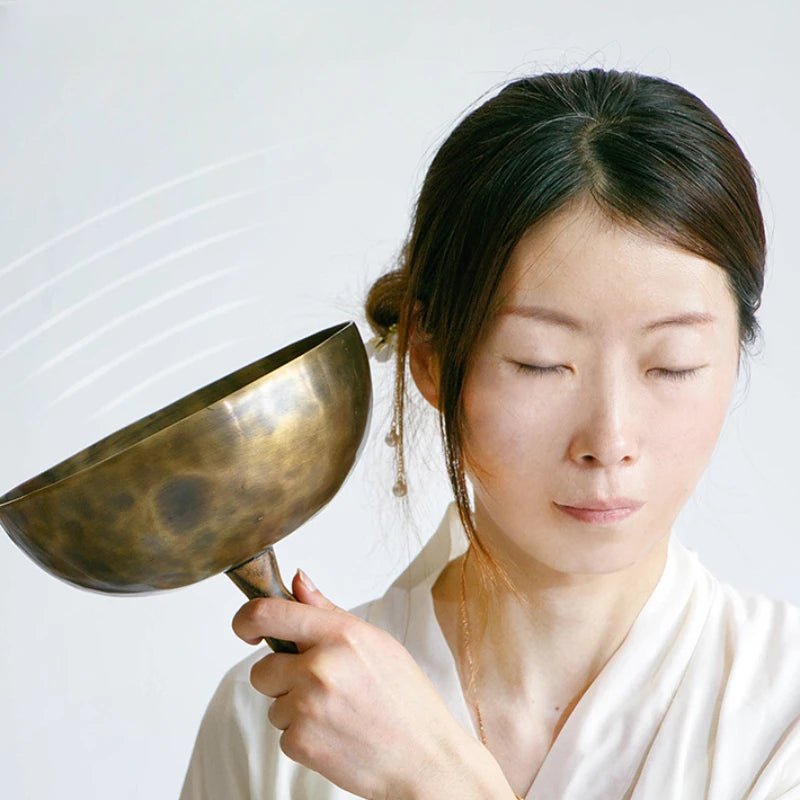 Handmade Tibetan singing bowl with wooden striker and cushion for meditation and prayer