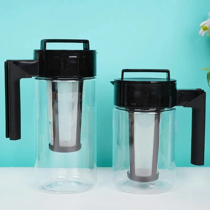 Two black-handled glass coffee makers with metal filters on a turquoise background