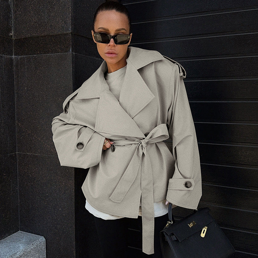 Women’s loose waistband long sleeve trench coat casual jacket in lightweight fabric.