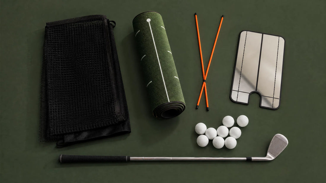 Golf training aids UK — practice net, putting mat, alignment sticks, swing mirror and foam balls on forest green background