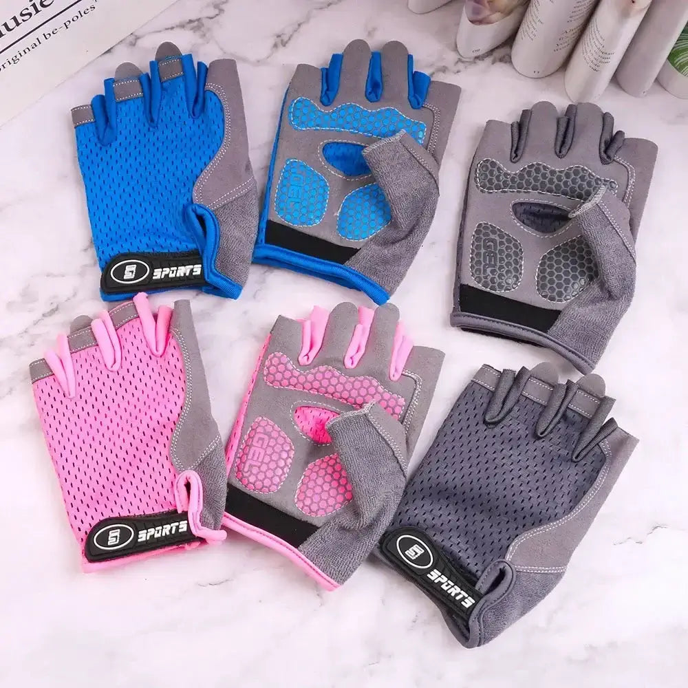 Kids golf gloves UK  - Set of six gloves in blue, gray, pink, and gray with pink accents on a marble surface.
