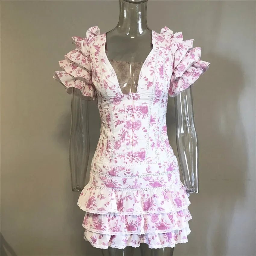 Light pink mini dress with sweet floral print, v-neck and ruffle details.