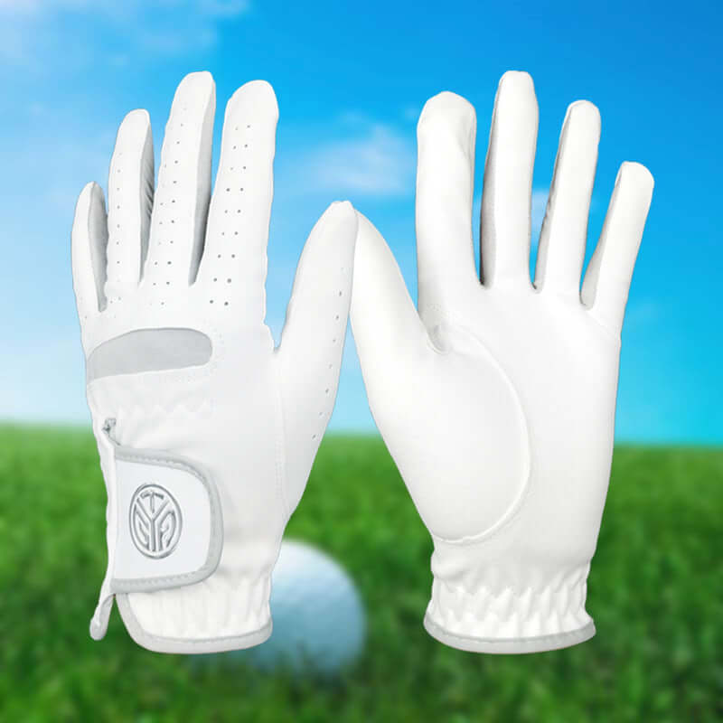 Golf gloves UK — White wear resistant grip gloves for men and women on blurred grass background.