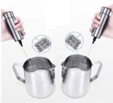 Two metal cups with straws and a small container of liquid on a white background