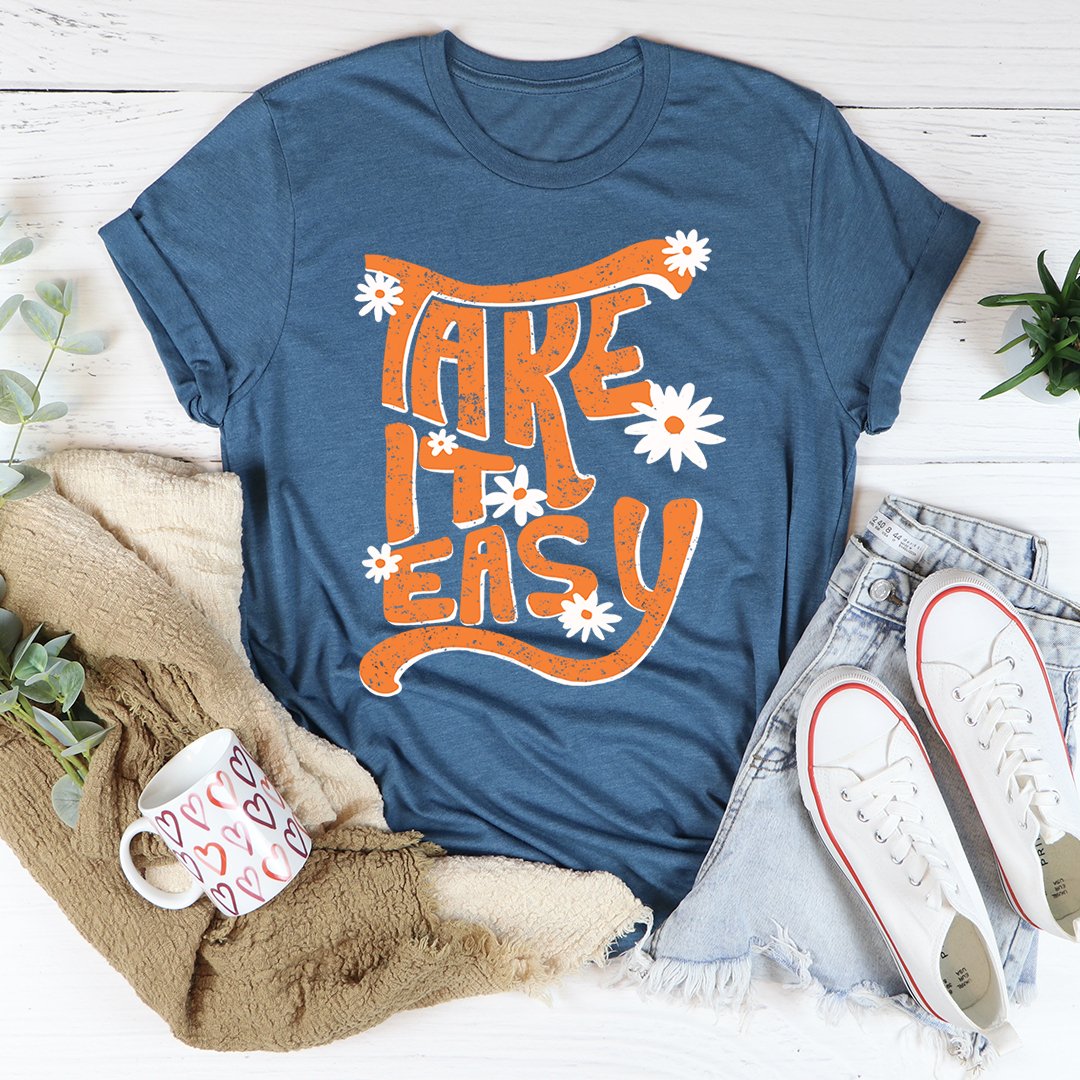 A comfortable and casual T-shirt featuring the words "Take it easy" in a relaxed font, perfect for leisure and comfort.