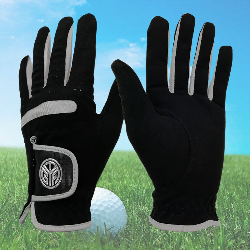 Golf gloves UK — two black wear resistant grip gloves with a golf ball on grass .