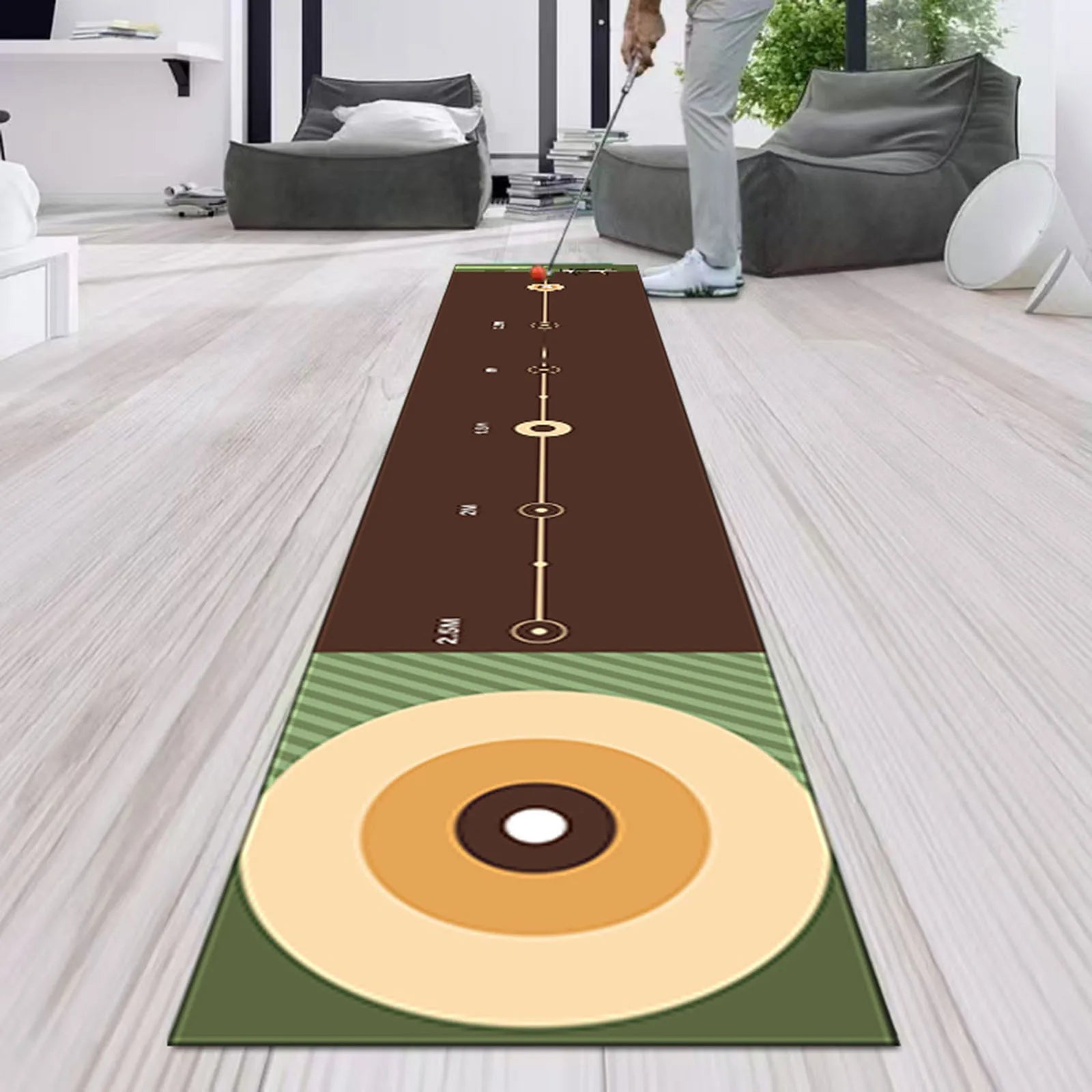 Golf practice mat on a wooden floor with a person holding a golf club.