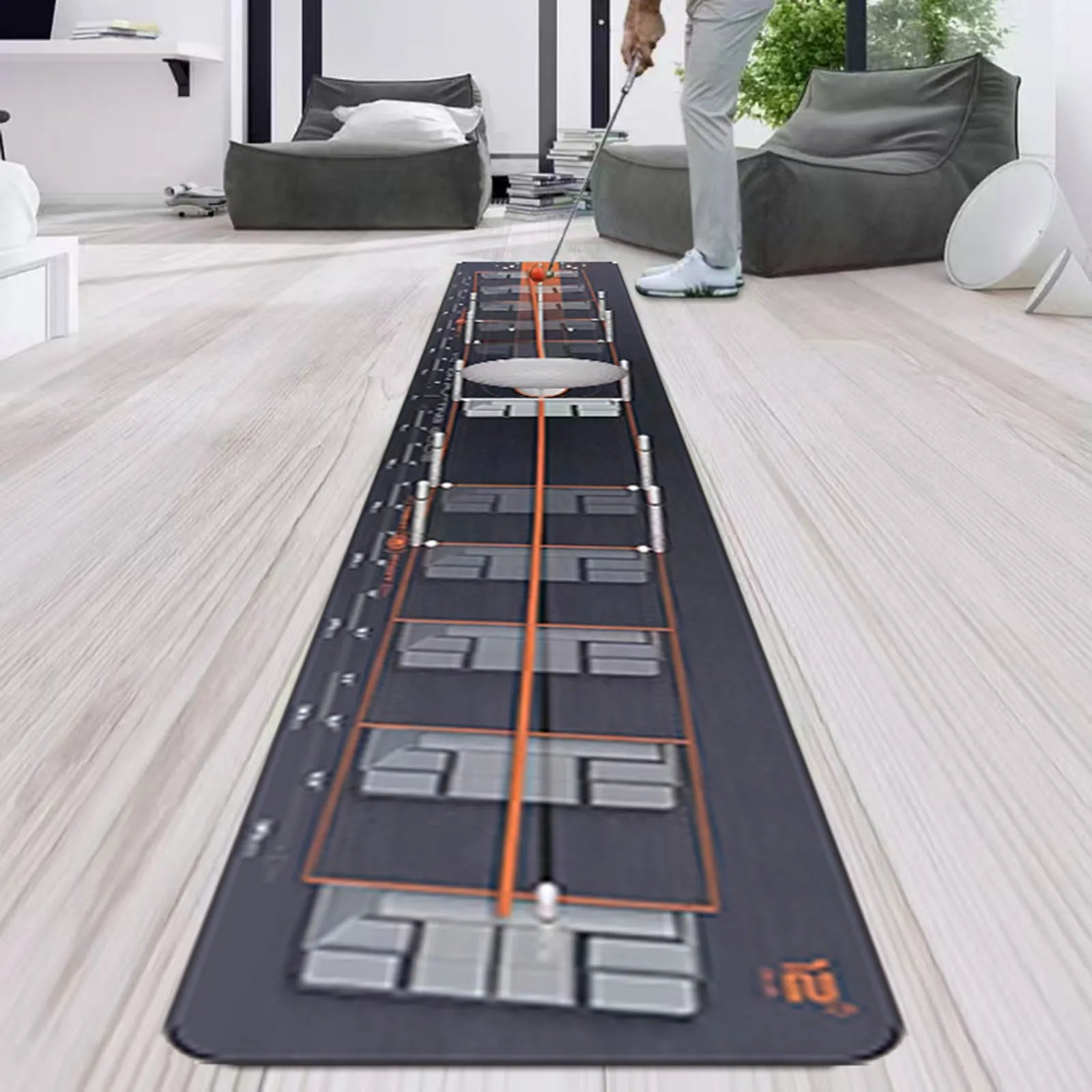 Golf simulator mat with golf club on a wooden floor in a modern living room.