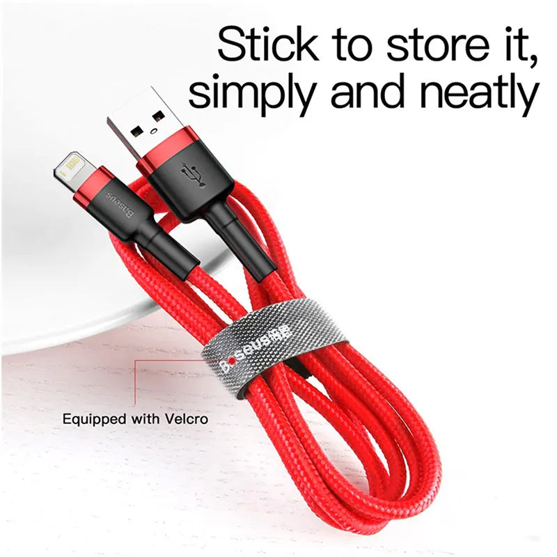 Red charging cable with Velcro strap on a white background
