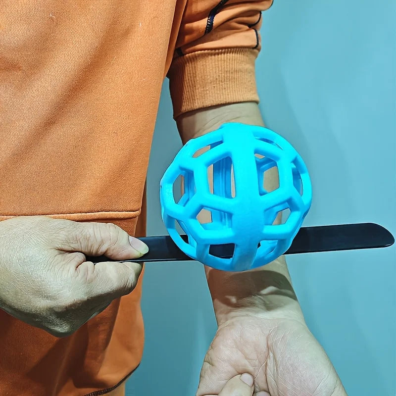 golf swing trainer UK - Person holding a blue plastic ball with a black tool against a light blue background
