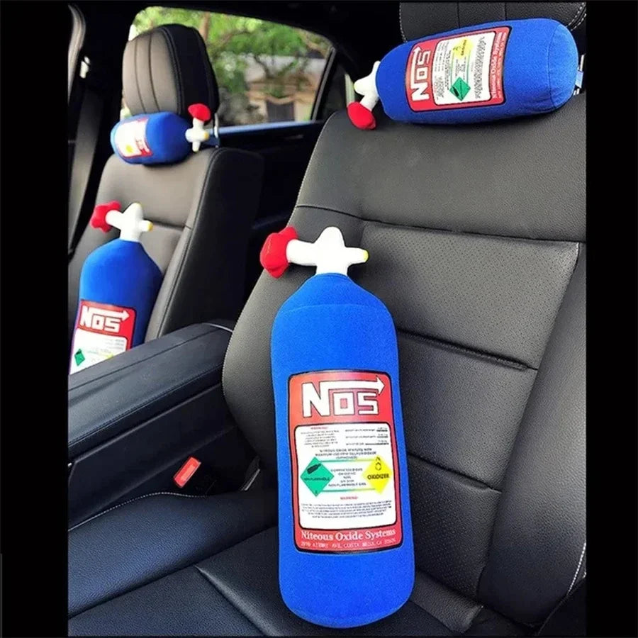 Blue NOS bottle-shaped car headrests on a car seat.