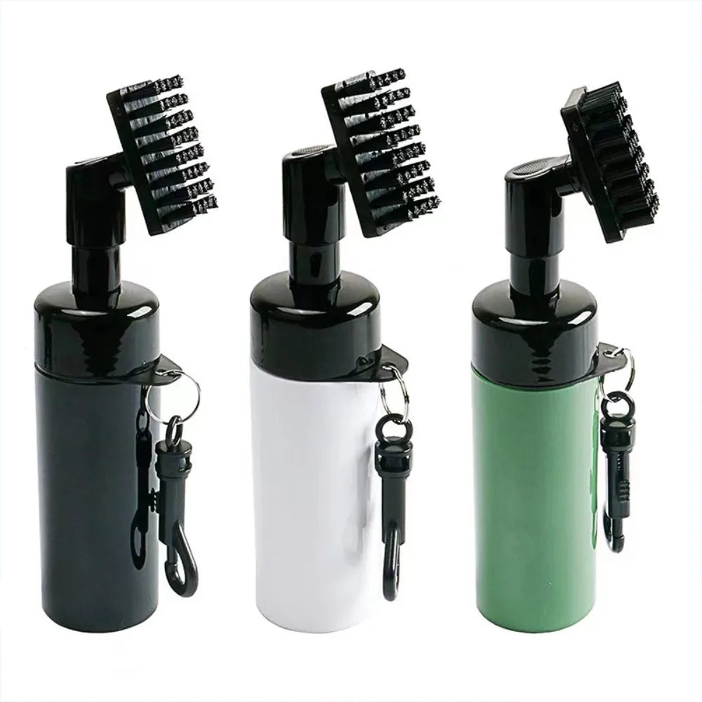 Three black spray bottles with brush attachments on a white background