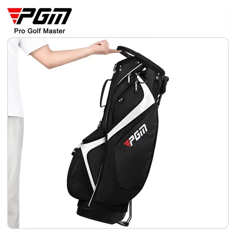 Black golf bag with white accents and 'PGM' branding held by a person wearing a white shirt.