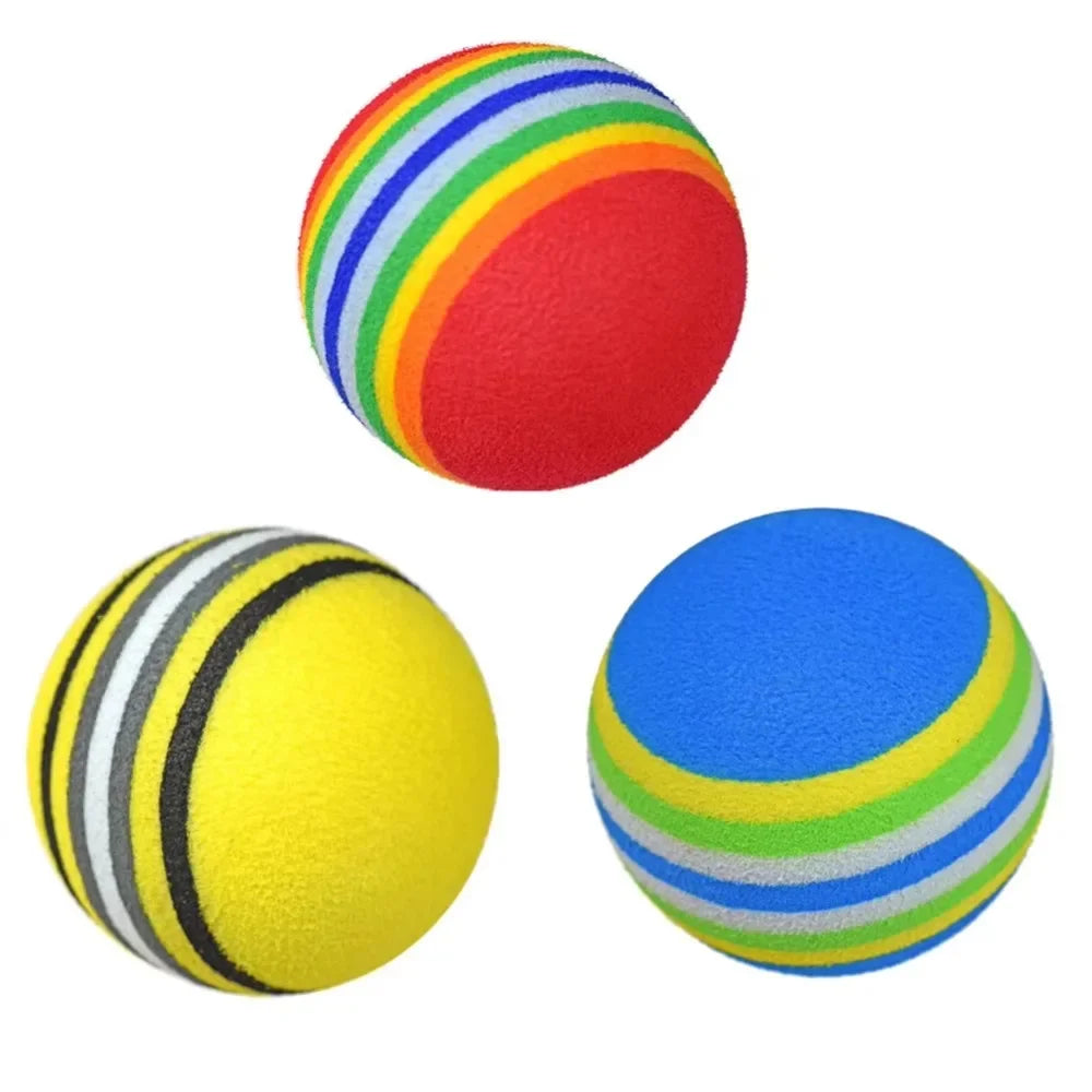Three colorful striped foam golf balls UK on a white background