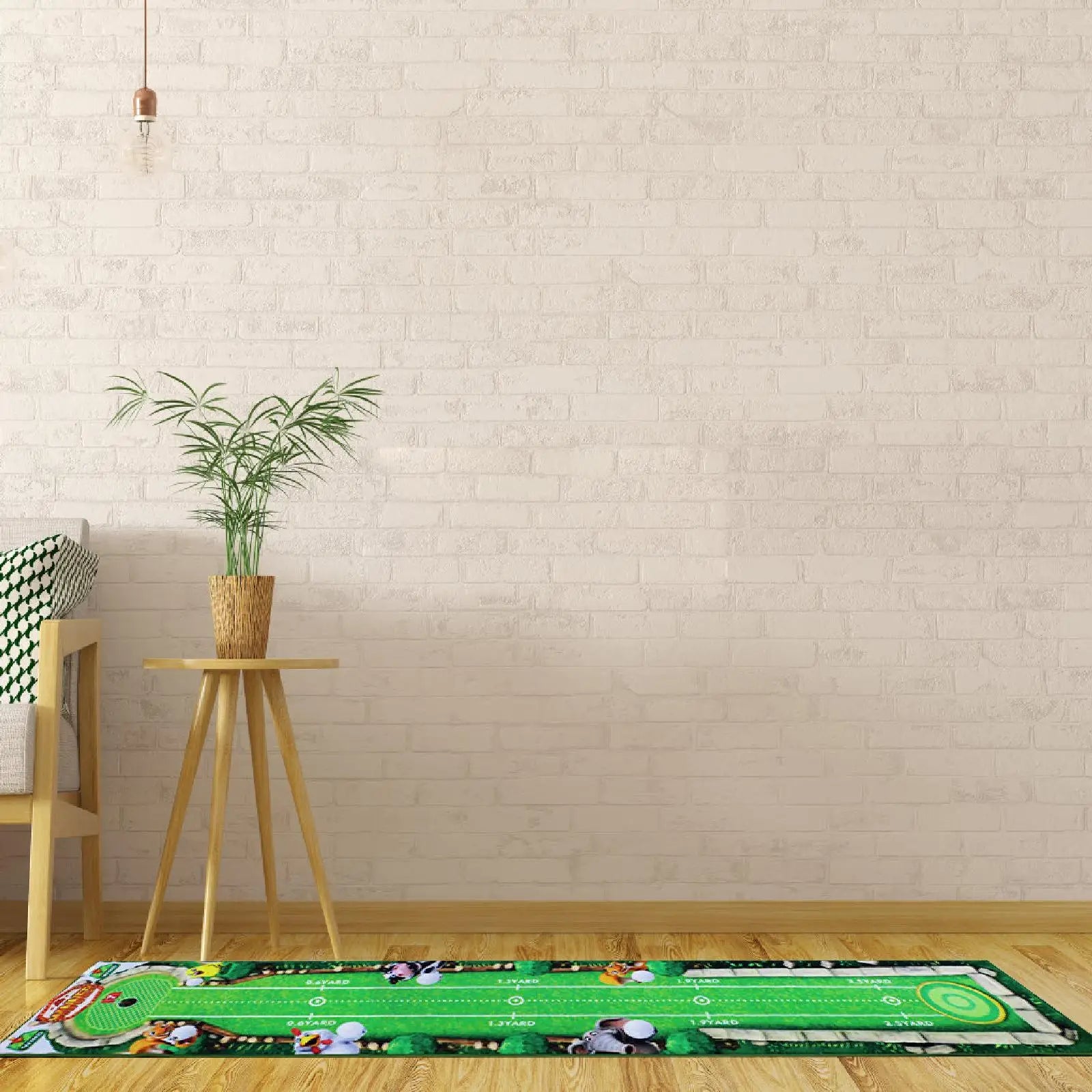 Green sports-themed rug on a wooden floor with a plant and small table against a light brick wall.