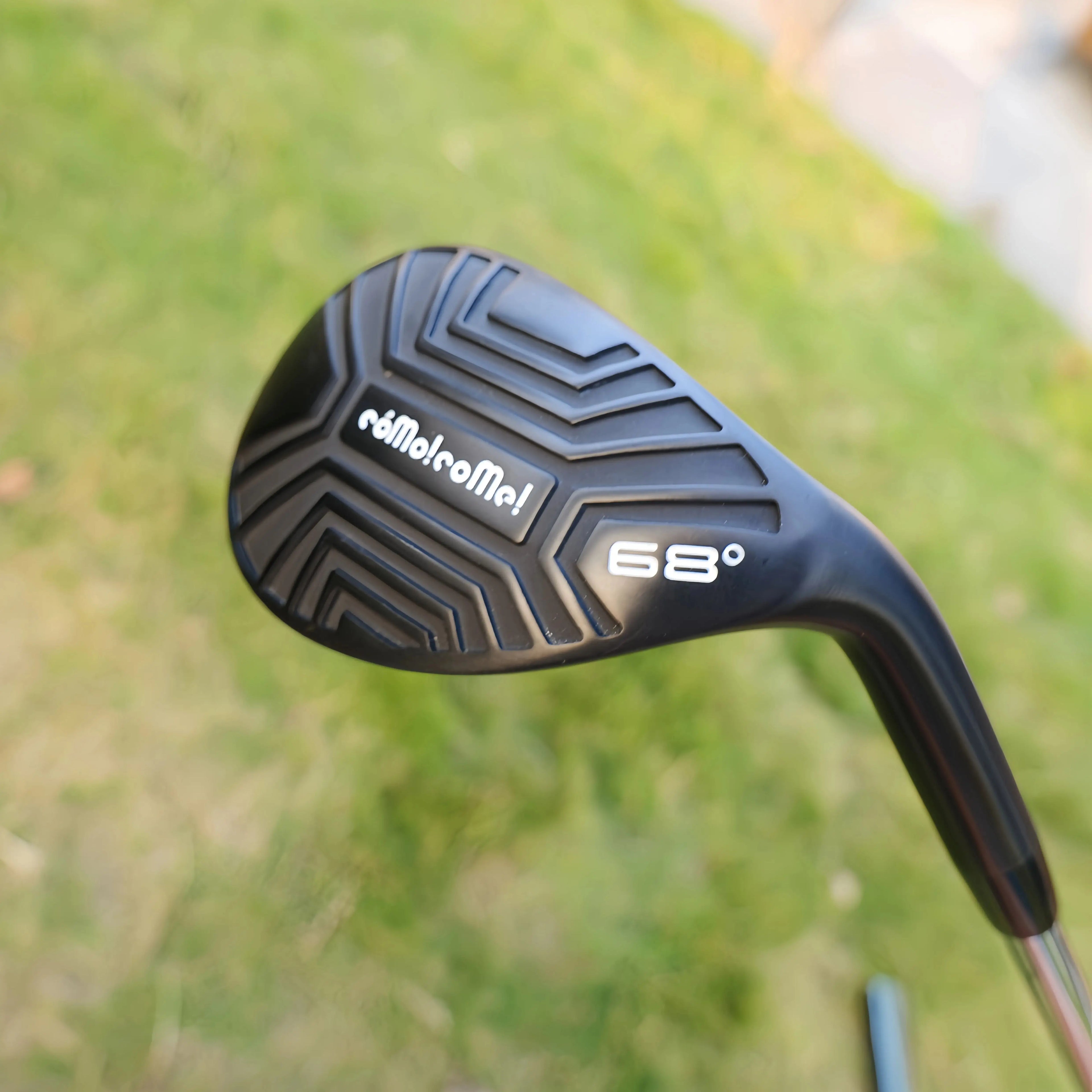 high loft golf wedge UK - Golf club head with 'Calliope' branding and '68°' angle on a blurred grass background