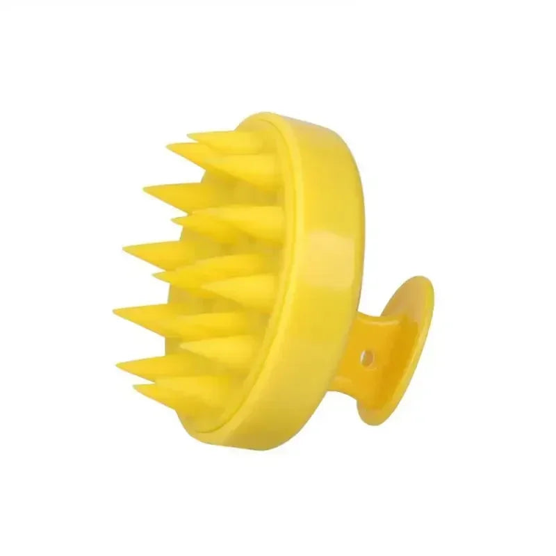Yellow rubber brush with spikes on a white background