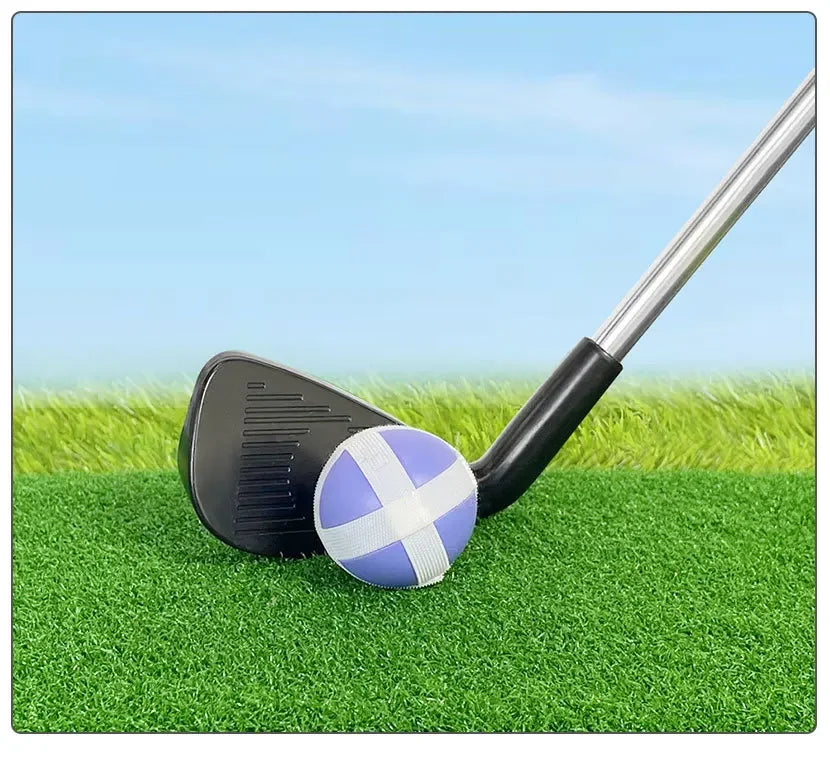Golf club and ball on a grassy background