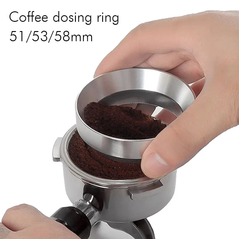 Coffee dosing ring with coffee grounds being measured by a hand on a white background