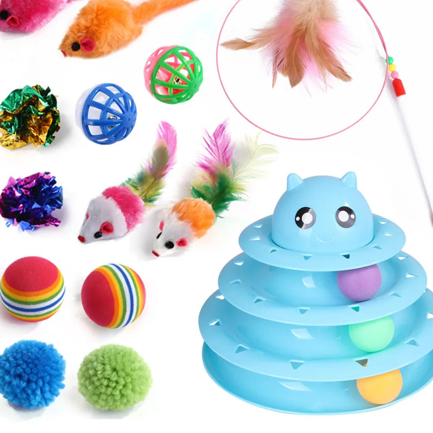Assorted cat toys including a blue spiral toy, colorful balls, and feather toys on a white background.