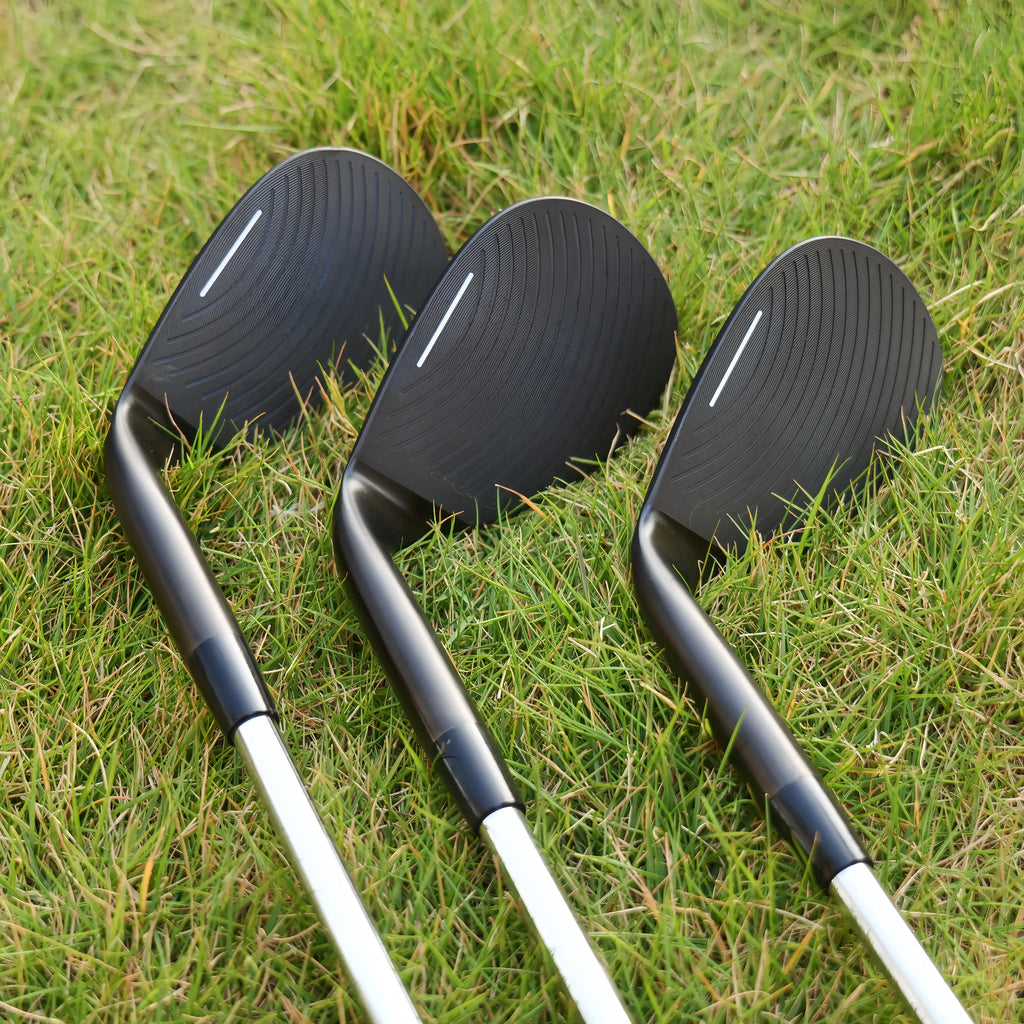 high loft golf wedge UK - Three golf club heads on a grassy background