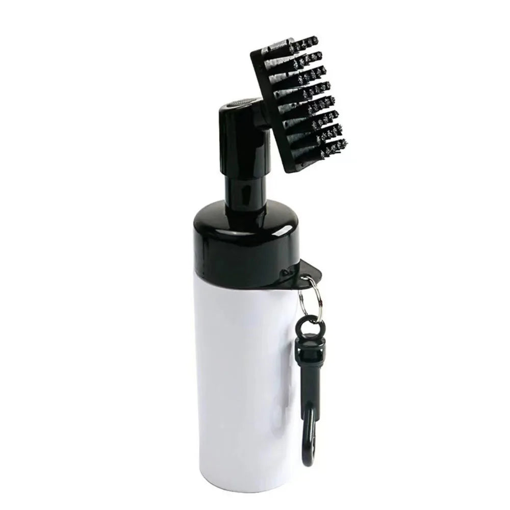 Golf club cleaner UK - White bottle with black cap and bristle brush on a white background