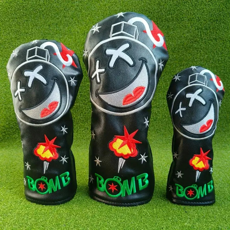 golf club cover UK -Three golf club head covers with bomb design on a green background
