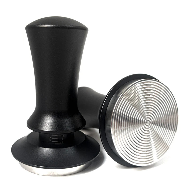 Black metal espresso tamper on a white background