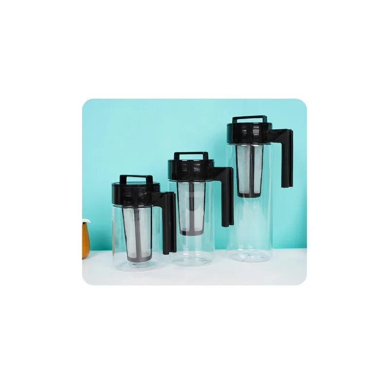 Set of three black and clear plastic containers on a white surface with a light blue background