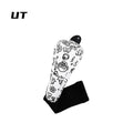 golf club head covers UK - A black and white patterned sleeve or cover with a black top cap and a black rectangular base, shown on a plain white background. The word 'UT' appears in the top left corner.