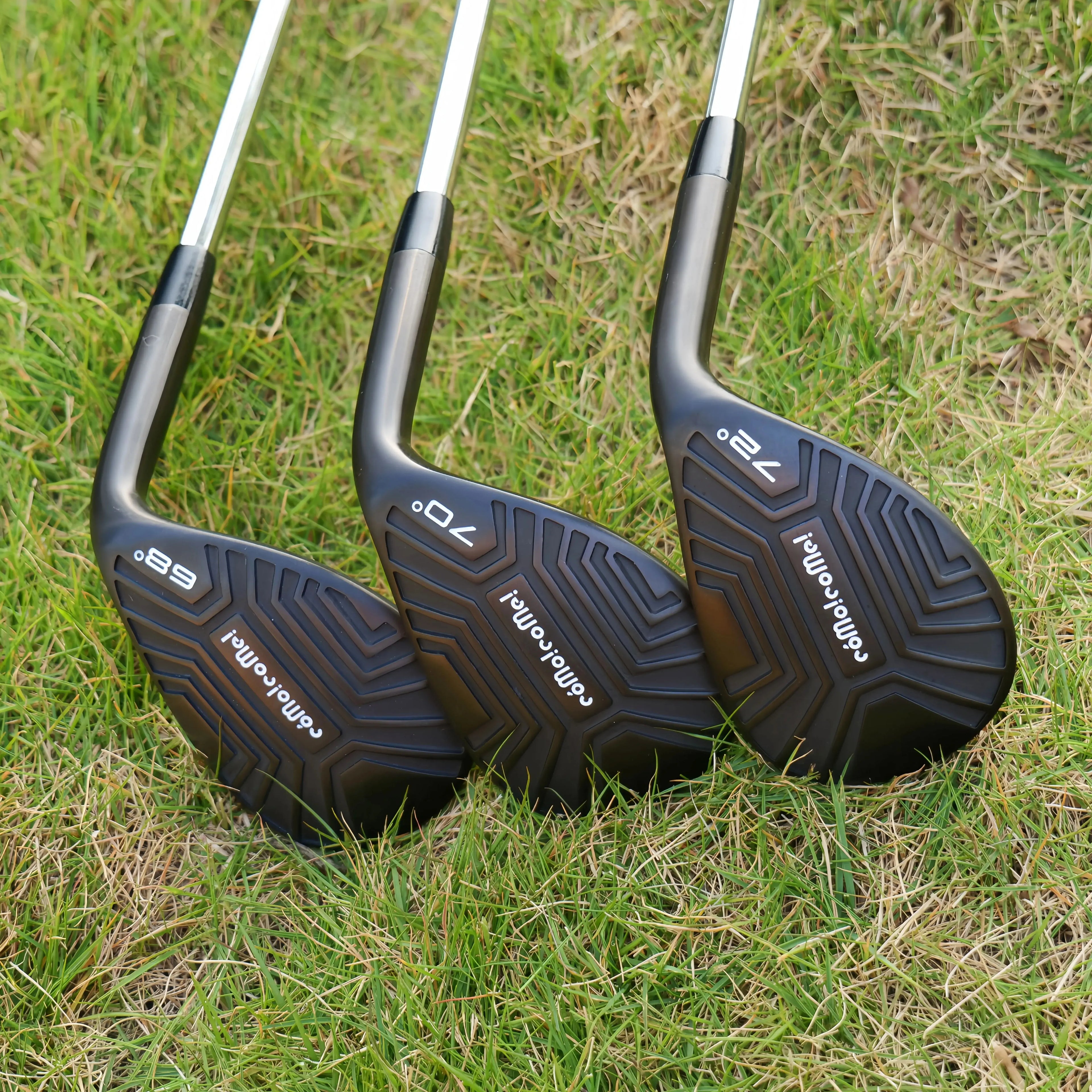 high loft golf wedge UK - Three golf club heads on grass with visible brand name.