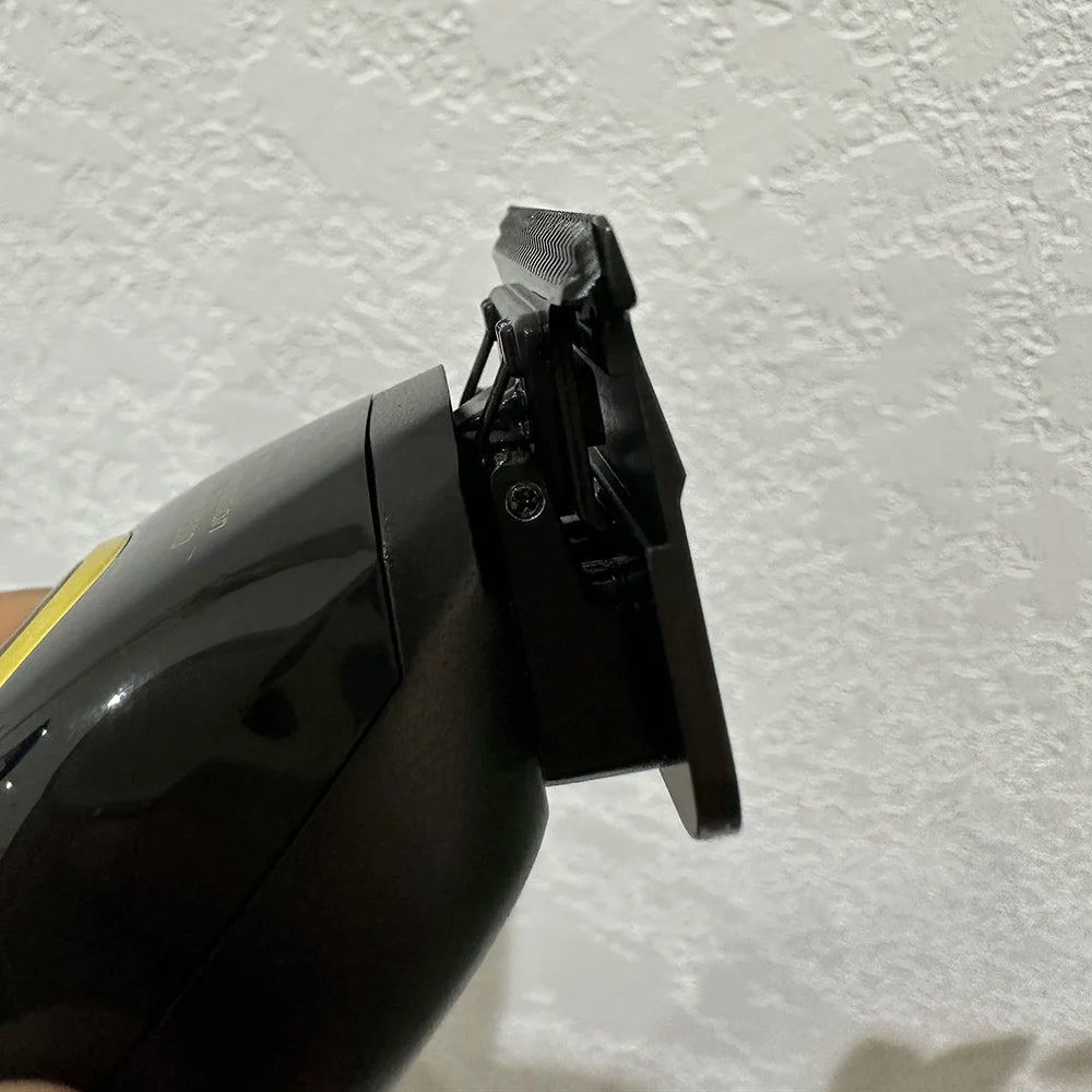 Black hair clipper on a textured white background
