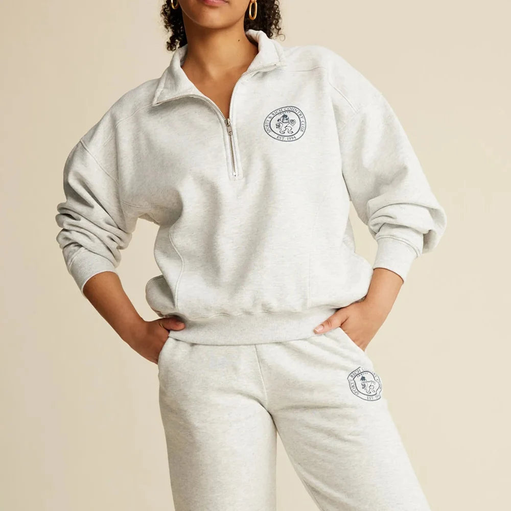 A stylish women's sweatshirt featuring a bold graphic print design. The sweatshirt is part of the ZESSAM Club collection and showcases a modern, trendy look with the word "Club" prominently displayed in large, eye-catching letters