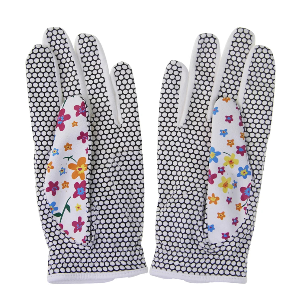 Pair of women's golf gloves UK with floral pattern on a white background