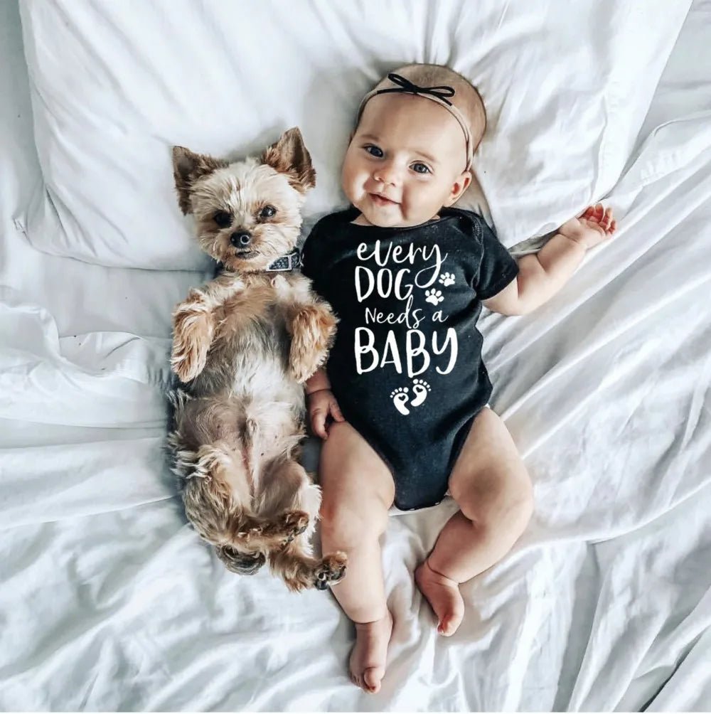 Baby wearing Print Romper with dog.