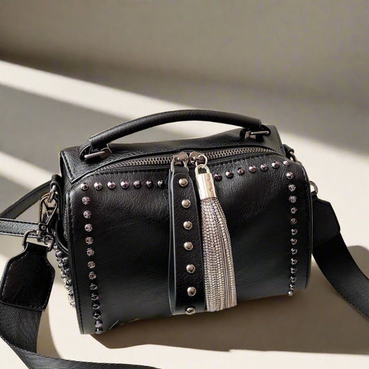  Fashion rivet women's handbag with a wide strap, available in shoulder bags, crossbody bags, and classic black totes. 