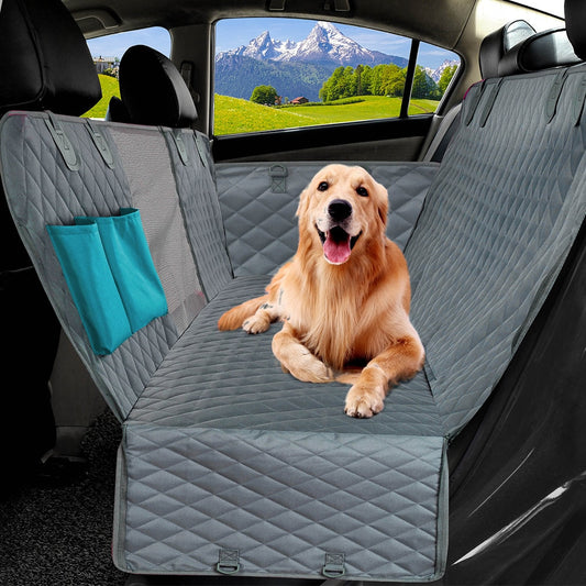 PETRAVEL Dog Car Seat Cover - Waterproof and durable rear back seat protector mat for a clean and comfortable ride. Ideal for pet owners on the go. A dog sitting on the rear seat of the car on protective mat.