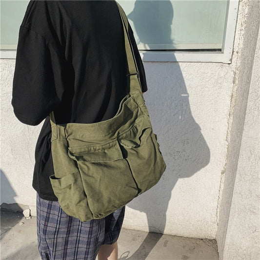 A model carrying the school messenger bag|Designer Handbag Solid Large capacity on her shoulder.