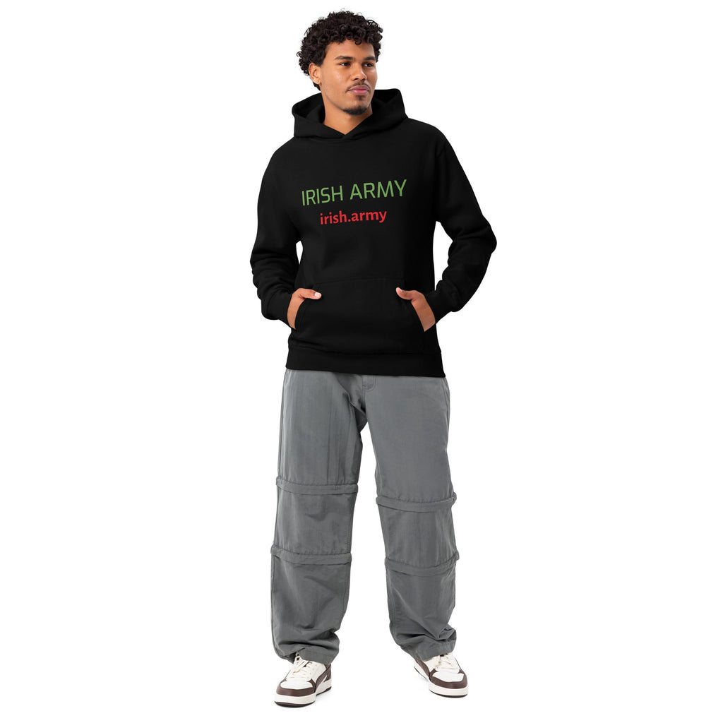 Person wearing a black hoodie with 'Irish Army' text and gray cargo pants on a white background