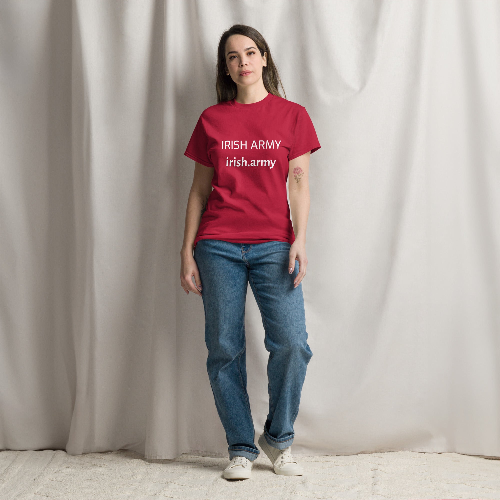 Person wearing a red 'IRISH ARMY' t-shirt against a plain background