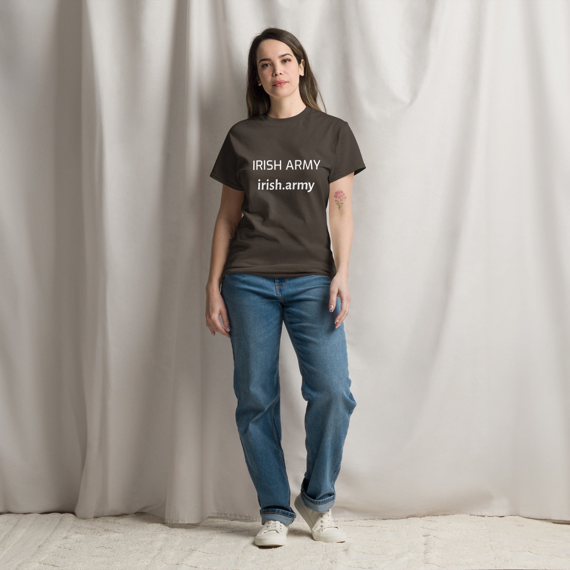 Person wearing a brown t-shirt with 'IRISH ARMY' text against a plain background