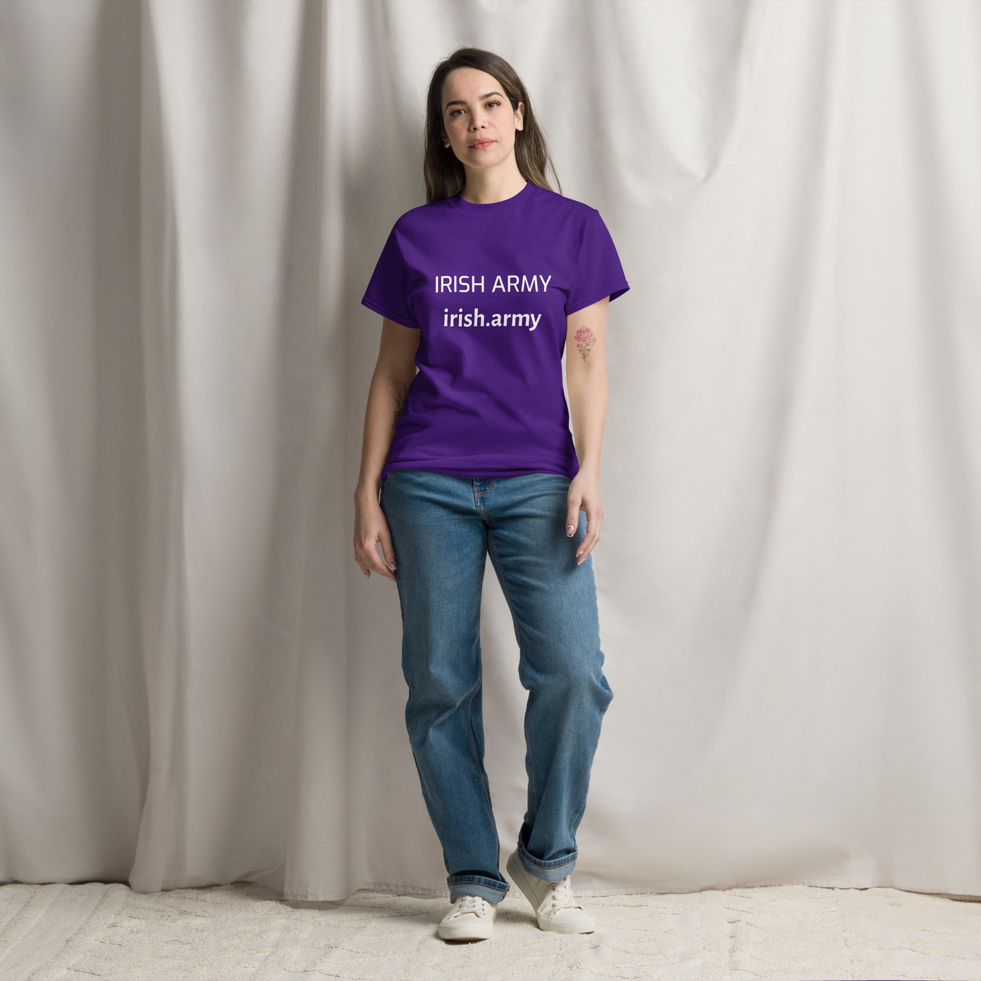 Person wearing a purple t-shirt with 'IRISH ARMY' text against a plain background