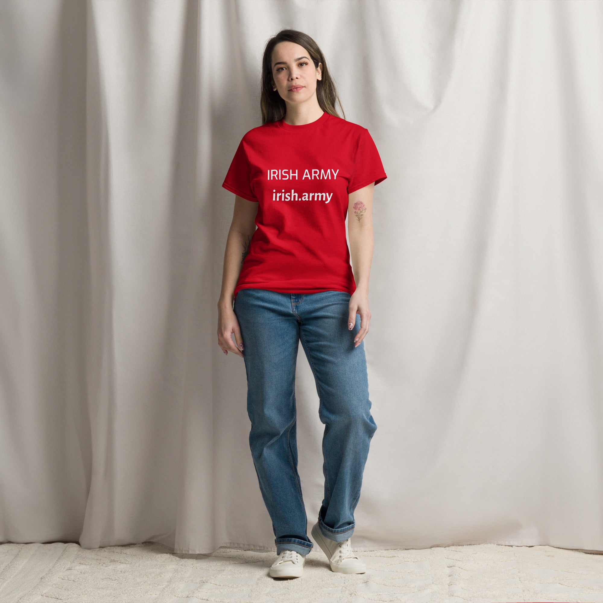 Person wearing a red 'IRISH ARMY' t-shirt against a plain background